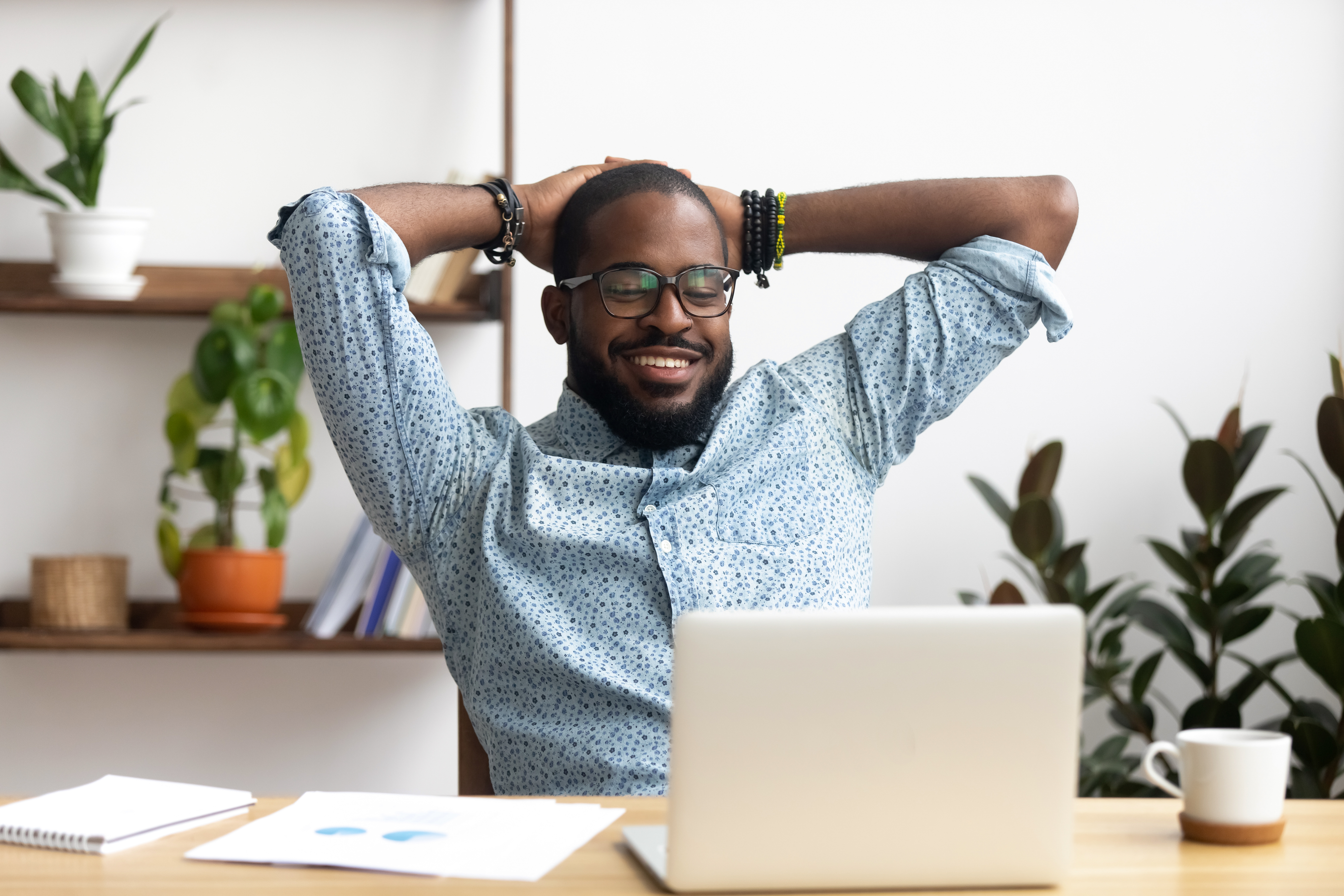 Man happy and looking at computer